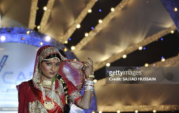 An Indian model performs for the semi-finals of 'Indian Super Queen' beauty contest for the transgendered community in Mumbai on February 13, 2010....