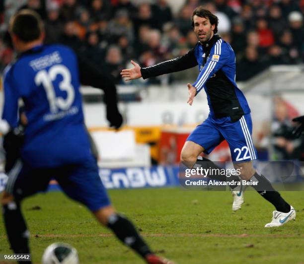 Ruud van Nistelrooy of Hamburger SV gestures to teammate Robert Tesche before he scores his second goal during the Bundesliga first division soccer...