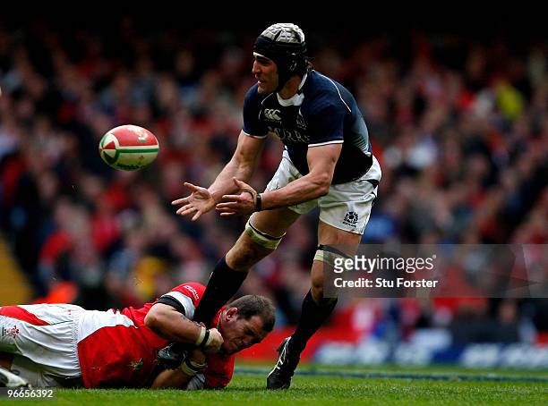 Scotland player Kelly Brown runs through the challenge of Paul James during the RBS 6 Nations Championship match between Wales and Scotland at the...