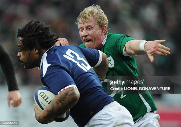 France national team's centre Mathieu Bastareaud runs with the ball near Ireland national team's lock Leo Cullen during the Six Nations rugby union...