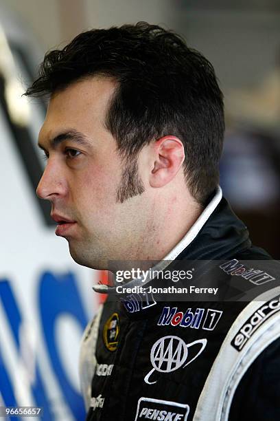 Sam Hornish Jr., driver of the Mobil 1 Dodge, stands in the garage area during practice for the Daytona 500 at Daytona International Speedway on...