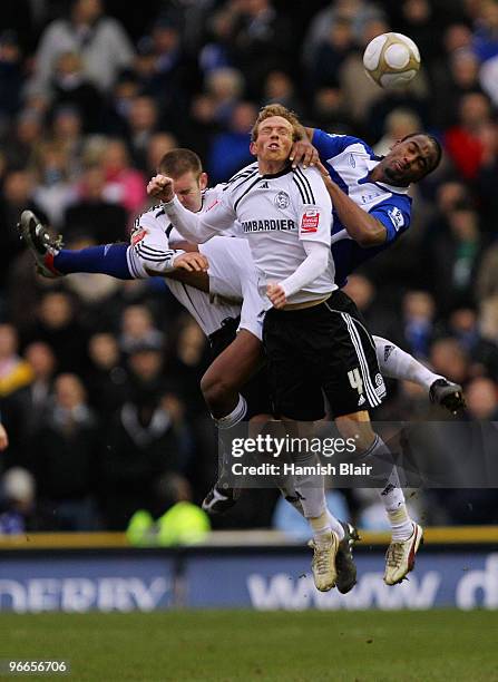 Jake Buxton and Paul Green of Derby contest with Cameron Jerome of Birmingham during the FA Cup sponsored by E.ON 5th Round match between Derby...
