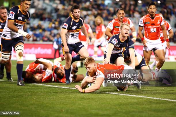 Edward Quirk of the Sunwolves dives over to score a try during the round 16 Super Rugby match between the Brumbies and the Sunwolves at GIO Stadium...