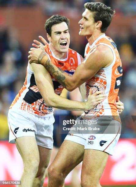 Rory Lobb of the Giants celebrates a goal with Callan Ward of the Giants during the round 11 AFL match between the Adelaide Crows and the Greater...