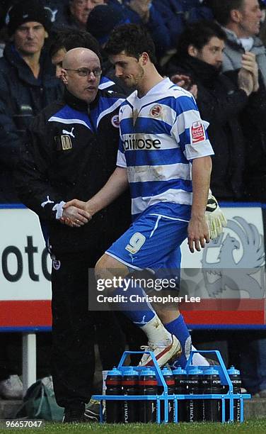 Shane Long of Reading is spoken to by manager Brian McDermott after he is sent of by referee Chris Foy during the FA Cup 5th round match between...