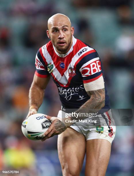 Blake Ferguson of the Roosters runs with the ball during the round 13 NRL match between the Sydney Roosters and the Wests Tigers at Allianz Stadium...