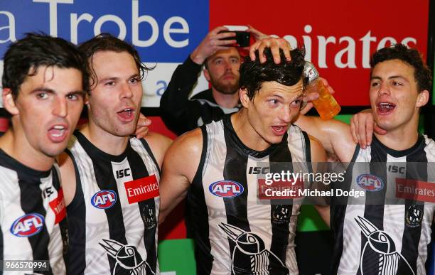 Brody Mihocek of the Magpies celebrates the win in his first match with teammates during the round 11 AFL match between the Collingwood Magpies and...