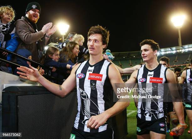 Brody Mihocek of the Magpies celebrates the win with fans in his first match during the round 11 AFL match between the Collingwood Magpies and the...