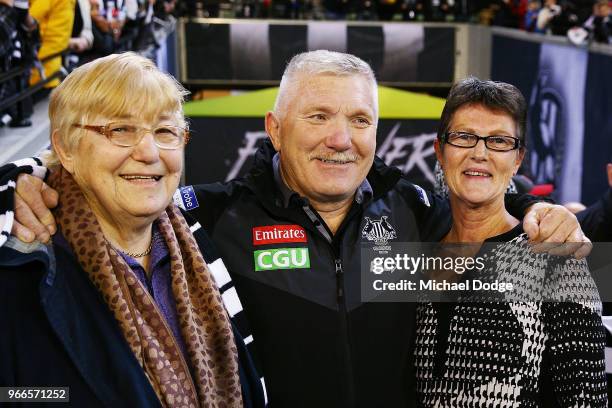 Brody Mihocek of the Magpies father Jack Mihocek with his mother and wife celebrate the win during the round 11 AFL match between the Collingwood...