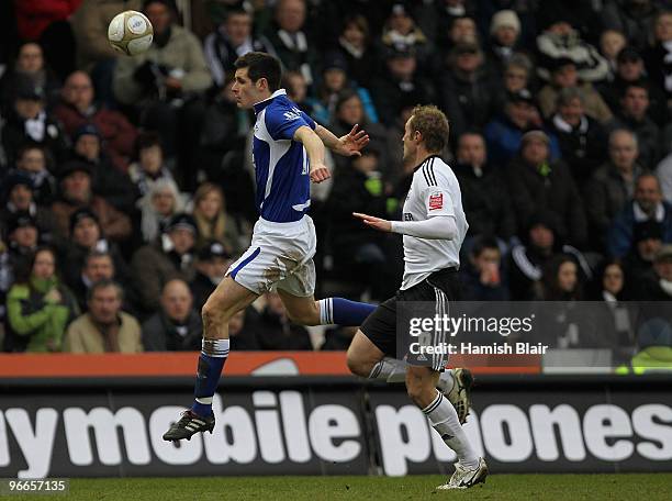 Scott Dann of Birmingham gets to the ball in front of Rob Hulse of Derby during the FA Cup sponsored by E.ON 5th Round match between Derby County and...