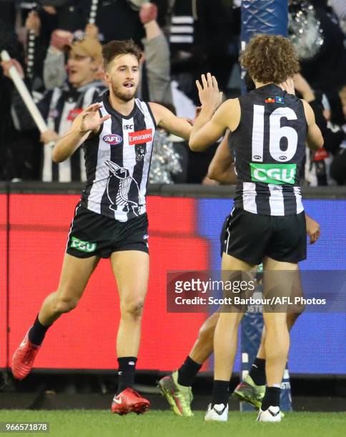 Tom Phillips of the Magpies celebrates after kicking a goal during the round 11 AFL match between the Collingwood Magpies and the Fremantle Dockers...