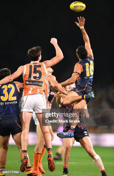 Eddie Betts of the Adelaide Crows flys high for a spoil in front of Sam Taylor of the Giants during the round 11 AFL match between the Adelaide Crows...