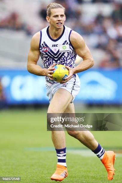 Nat Fyfe of the Dockers runs with the ball during the round 11 AFL match between the Collingwood Magpies and the Fremantle Dockers at Melbourne...