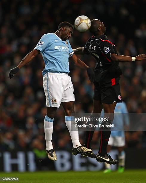 Kolo Toure of Manchester City competes for the ball in the air with Mamady Sidibe of Stoke City during the the FA Cup sponsored by E.ON Fifth round...