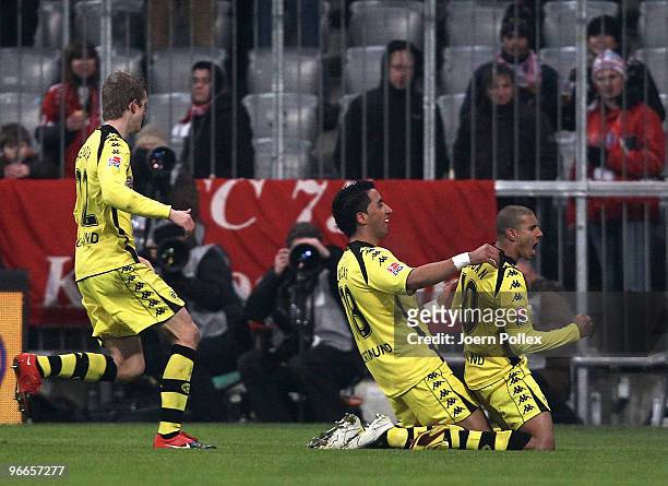 Mohamed Zidan of Dortmund celebrates with his team mates after scoring his team's first goal during the Bundesliga match between FC Bayern Muenchen...