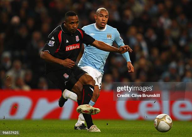 Ricardo Fuller of Stoke City passes the ball under pressure from Nigel de Jong of Manchester City during the the FA Cup sponsored by E.ON Fifth round...