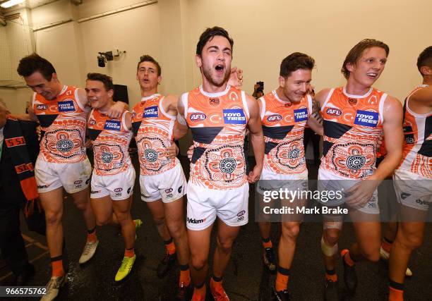 The Giants sing the team song during the round 11 AFL match between the Adelaide Crows and the Greater Western Sydney Giants at Adelaide Oval on June...