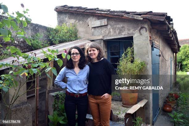 Ewenne and Marie pose in their house in Montauban, southern France on June 1, 2018. Ewenne and Marie are suing the Purpan hospital in Toulouse for...