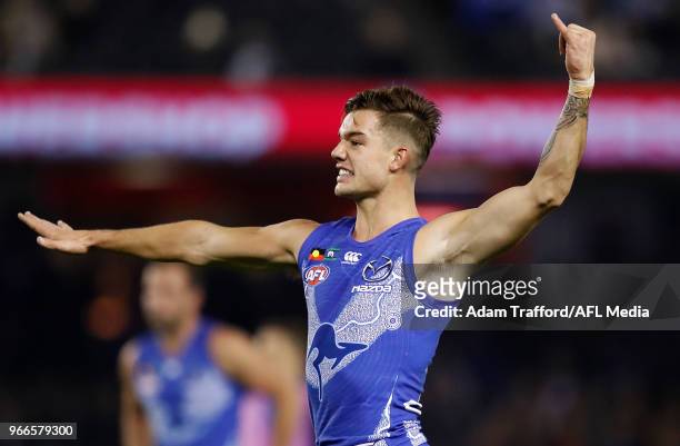 Jy Simpkin of the Kangaroos celebrates a goal during the 2018 AFL round 11 match between the North Melbourne Kangaroos and the Brisbane Lions at...
