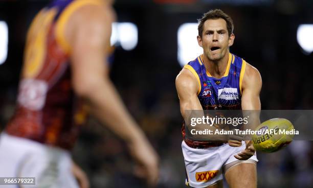 Luke Hodge of the Lions handpasses the ball during the 2018 AFL round 11 match between the North Melbourne Kangaroos and the Brisbane Lions at Etihad...