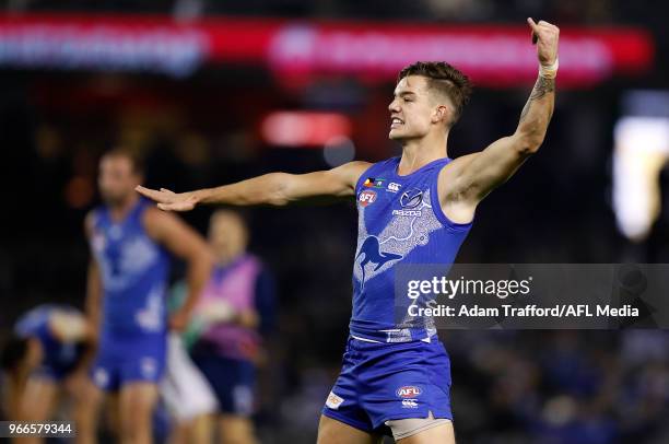 Jy Simpkin of the Kangaroos celebrates a goal during the 2018 AFL round 11 match between the North Melbourne Kangaroos and the Brisbane Lions at...