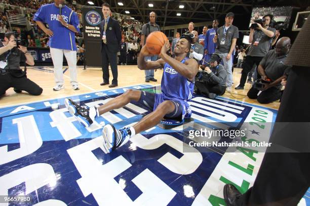 Dwight Howard of the Orlando Magic breaks the Guinness Book of World Record for longest shot sitting down during the East All-Stars Practice on...