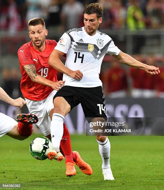 Germany's Leon Goretzka and Guido Burgstaller vie for a ball during the international friendly footbal match Austria versus Germany in Klagenfurt,...