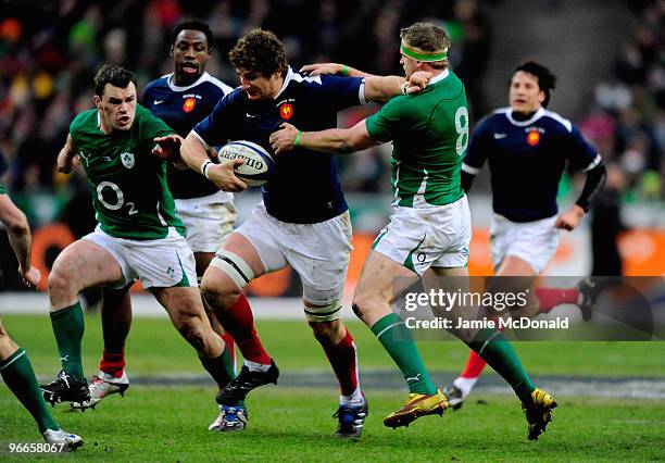 Pascal Pape of France holds off Jamie Heaslip of Ireland during the RBS Six Nations match between France and Ireland at Stade France on February 13,...