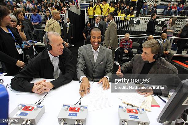 Broadcasters Doug Collins, Reggie Miller and Marv Albert talk during the East All-Stars Practice on center court during NBA Jam Session Presented by...