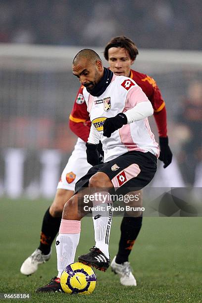 Rodrigo Taddei of AS Roma and Fabio Liverani of US Citta' di Palermo in action during the Serie A match between AS Roma and US Citta di Palermo at...