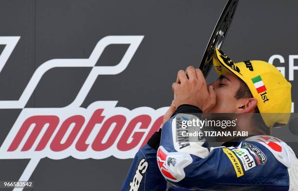 Del Conca Gresini Moto3 team Spanish Moto3 rider Jorge Martin celebrates on the podium as he kisses the trophy after winning the Italian Grand Prix...