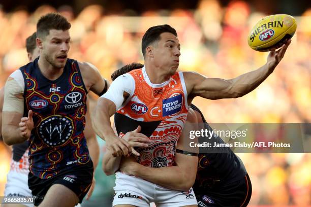 Dylan Shiel of the Giants is tackled by Josh Jenkins of the Crows during the 2018 AFL round 11 match between the Adelaide Crows and the GWS Giants at...