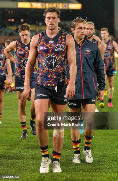 The Crows leave the ground after losing by 16 points to the Giants during the round 11 AFL match between the Adelaide Crows and the Greater Western...