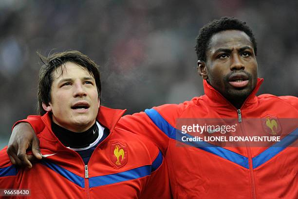 France national team's fly-half Francois Trinh-Duc and France national team's flanker Fulgence Ouedraogo listen to the national anthem during the Six...