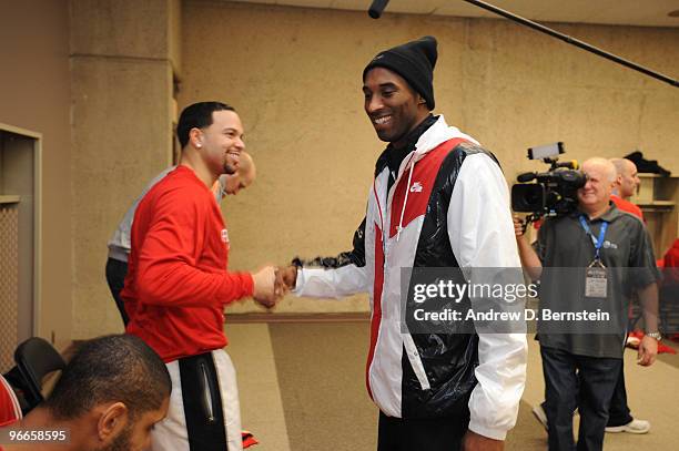 Kobe Bryant of the Los Angeles Lakers and Deron Williams of the Utah Jazz greet each other prior to the West All-Stars Practice on center court...