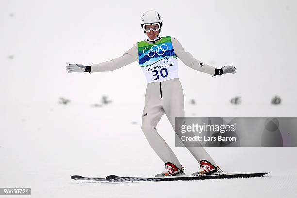 Martin Schmitt of Germany competes during the Ski Jumping Normal Hill Individual 1st round on day 2 of the Vancouver 2010 Winter Olympics at Whistler...