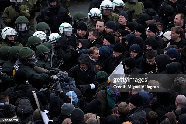 German riot police men stop Neo-Nazis to leave the square next to the railway station 'Neustadt' on February 13, 2010 in Dresden, Germany. Left-wing...