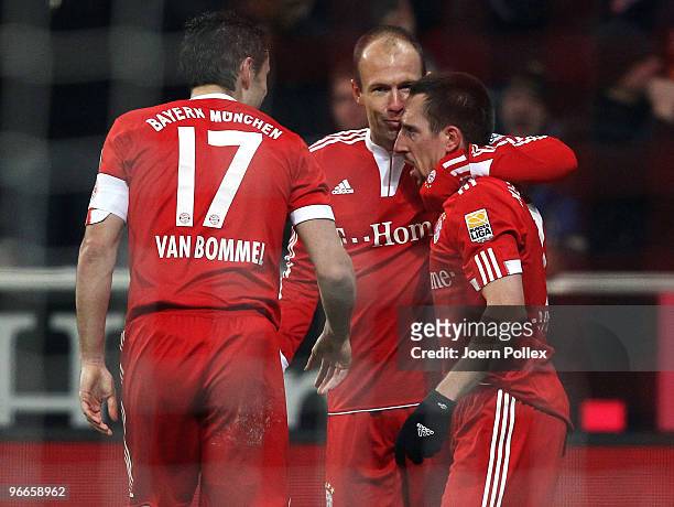 Arjen Robben of Bayern celebrates with his team mates Frank Ribery and Mark van Bommel after scoring his team's second goal during the Bundesliga...