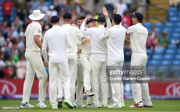 Dominic Bess of England celebrates with teammates after catching out Haris Sohail of Pakistan during day three of the 2nd NatWest Test match between...