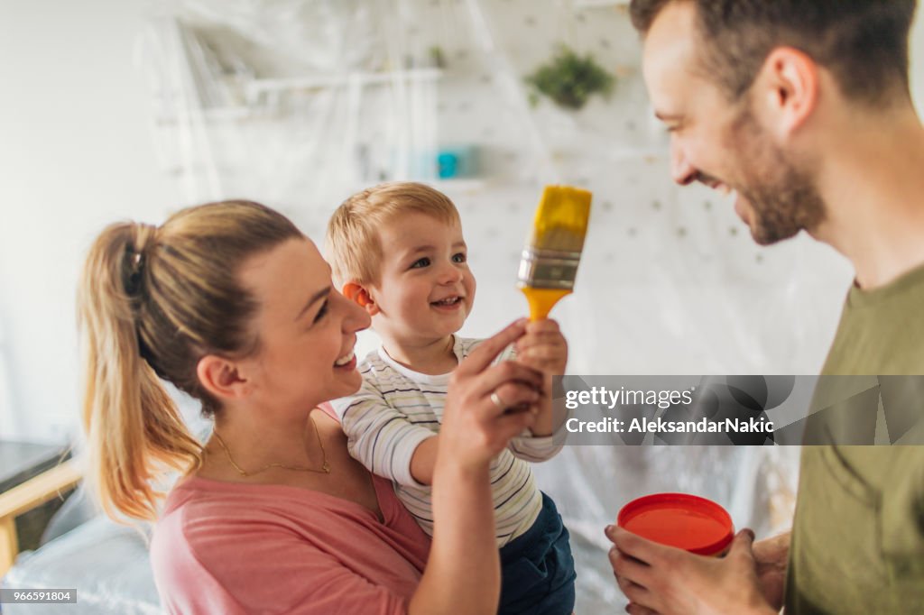 Young family repainting their home