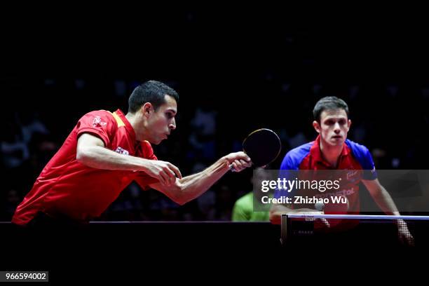 Ionescu Ovidiu of Romania and Robles Alvaro of Spain in action at the men's doubles final compete with Fan Zhendong and Lin Gaoyuan of China during...