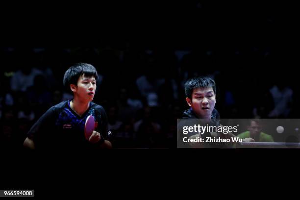 Fan Zhendong and Lin Gaoyuan of China in action at the men's doubles final compete with Ionescu Ovidiu of Romania and Robles Alvaro of Spain during...