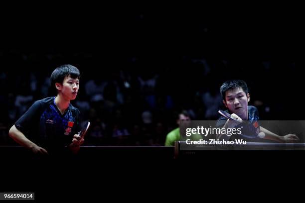 Fan Zhendong and Lin Gaoyuan of China in action at the men's doubles final compete with Ionescu Ovidiu of Romania and Robles Alvaro of Spain during...