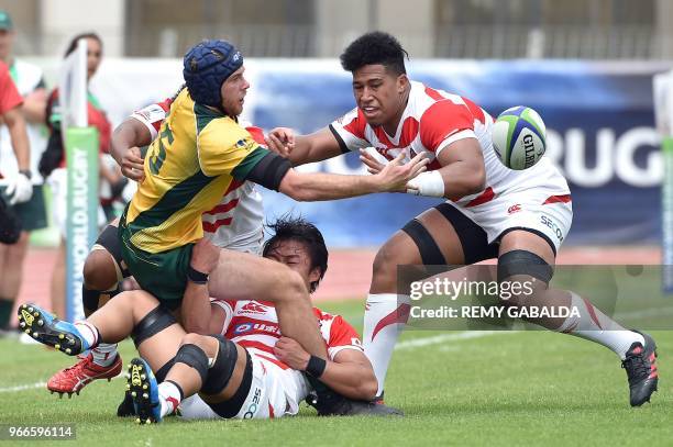 Australia's fullback Mack Hansen vies with Japan's number eight Asipeli Moala during the World union Rugby U20 Championship match between Australie...