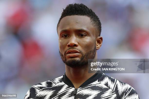 Nigeria's midfielder John Obi Mikel lines up for the anthems ahead of the International friendly football match between England and Nigeria at...