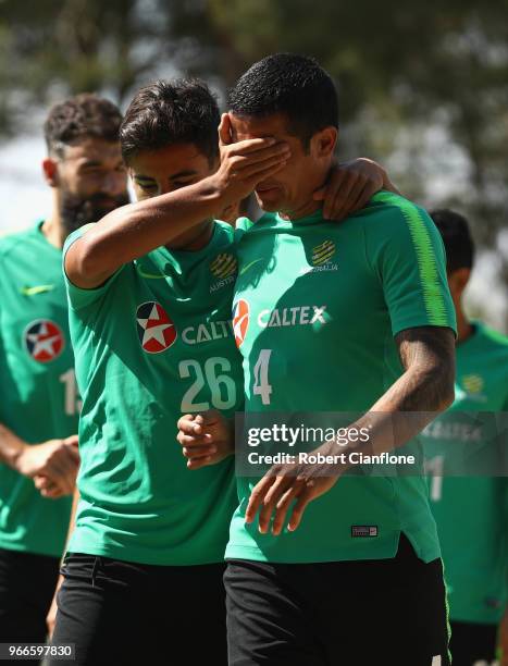 Tim Cahill and Daniel Arzani of Australia arrive for the Australian Socceroos Training Session at the Gloria Football Club on June 3, 2018 in...