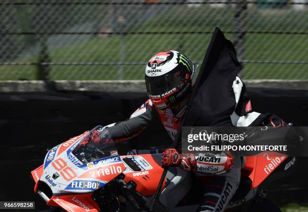 Ducati Team's Spanish rider Jorge Lorenzo celebrates after winning the Moto GP Grand Prix at the Mugello race track on June 3, 2018