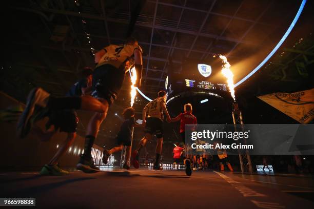 Player enter the court prior to the DKB HBL match between Rhein-Neckar Loewen and DHfK Leipzig at SAP Arena on June 3, 2018 in Mannheim, Germany.