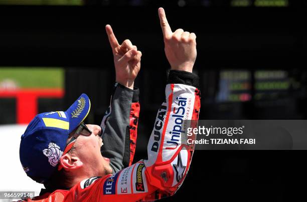 Ducati Team's Spanish rider Jorge Lorenzo celebrates after winning the Moto GP Grand Prix at the Mugello race track on June 3, 2018