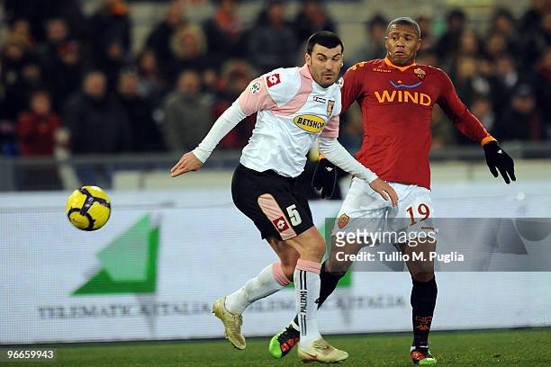 Cesare Bovo of Palermo and Julio Baptista of Roma compete for the ball during the Serie A match between AS Roma and US Citta di Palermo at Stadio...